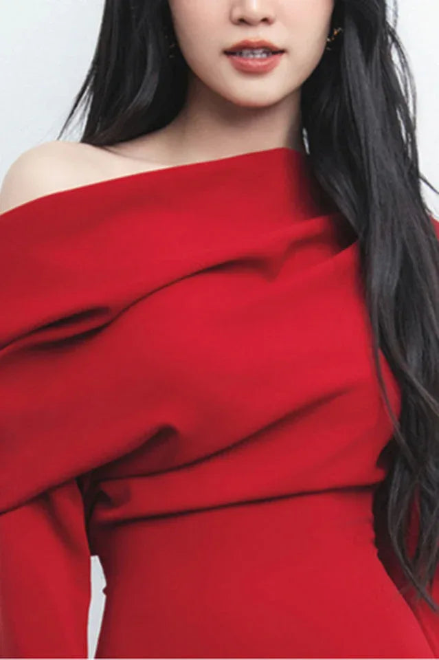 Elegant red dress featuring an off-the-shoulder design and cascading pleats