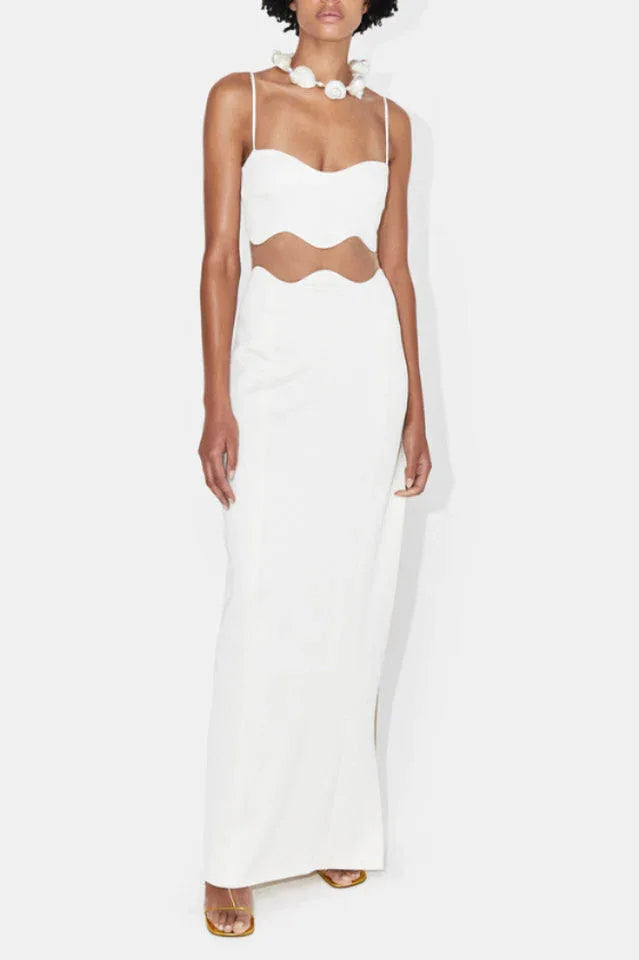 Woman wearing a white two-piece evening gown with a sweetheart neckline and spaghetti straps Main image