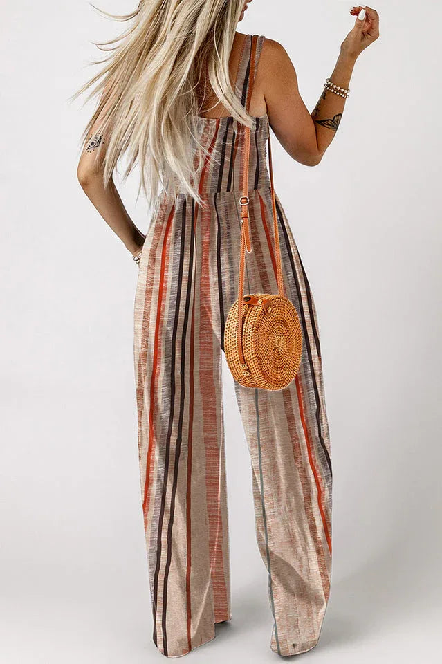 Back view of a woman modeling a sleeveless striped jumpsuit