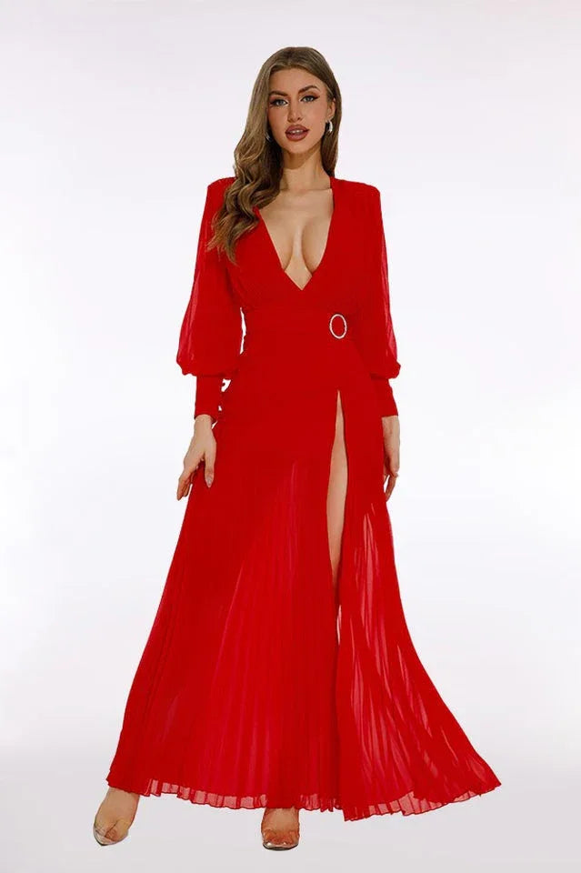 Full body shot of a woman in a red chiffon gown with a high slit and plunging neckline.