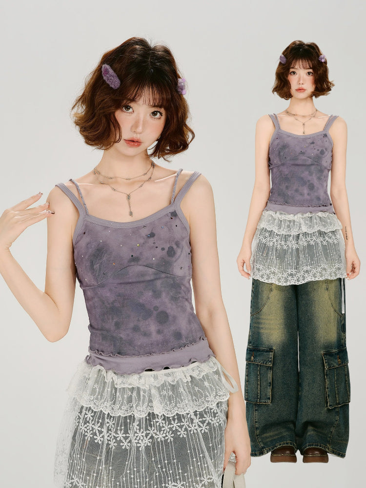 Full body shot of a woman in a purple tie-dye camisole and a lace skirt