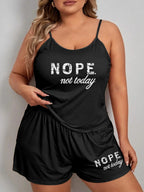 Front view of a black pajama set featuring a camisole with a graphic print