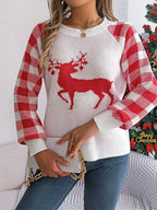 Woman wearing white festive reindeer knit sweater with red plaid sleeves