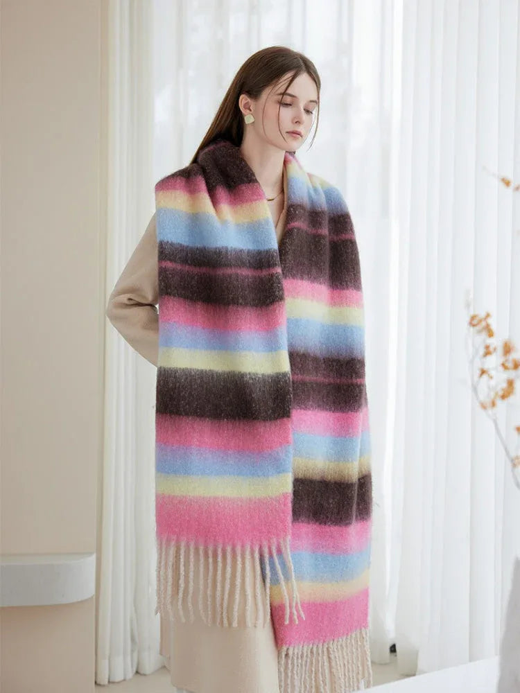 full body shot of a woman showcasing an oversized striped shawl scarf