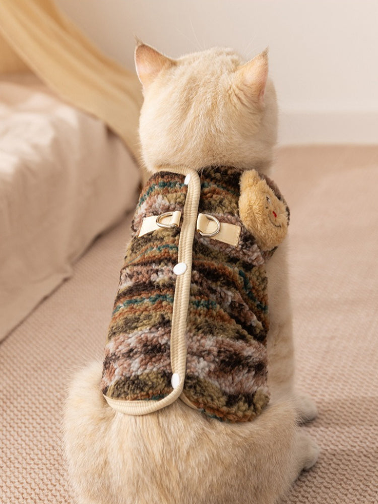 Back view of cat wearing multicolored fleece vest with decorative applique