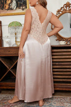 back view of a woman wearing a pink satin nightgown with lace details