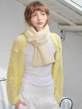 Cream knitted scarf styled with yellow mesh cardigan and white ensemble