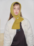 yellow knitted scarf worn as hood