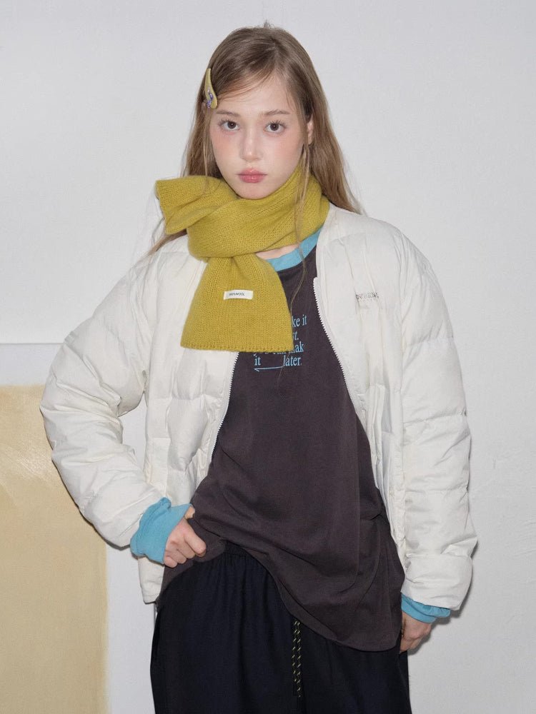 yellow knitted scarf tied in bow