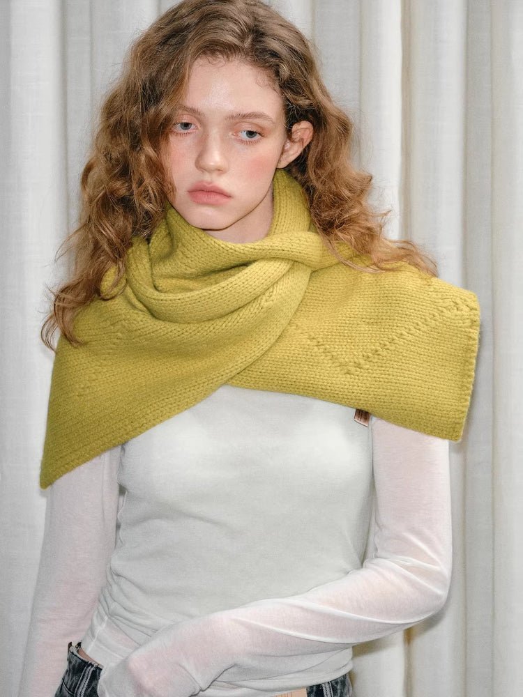 Model wearing yellow knitted wrap scarf