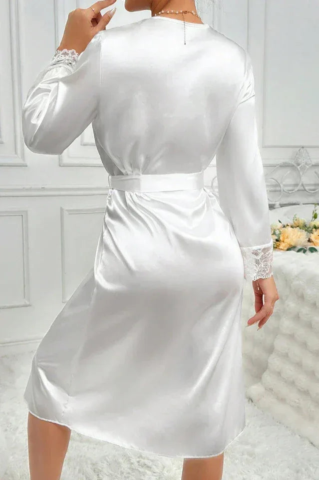 Detail of the lace sleeves on a white satin robe