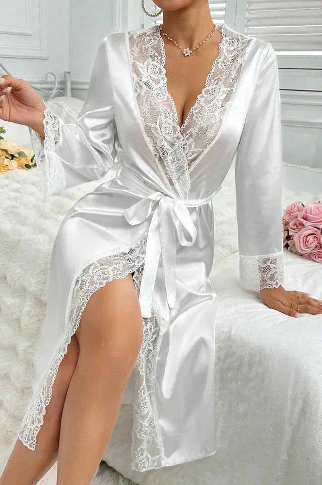 Close-up of a white satin robe with lace detailing