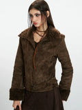 Front view of a woman wearing a brown faux suede jacket with shearling trim.