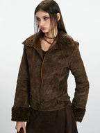 Front view of a woman wearing a brown faux suede jacket with shearling trim.