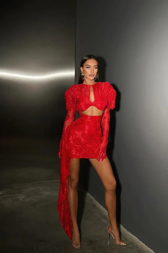 Full body shot of a woman in a red evening dress with long sleeves