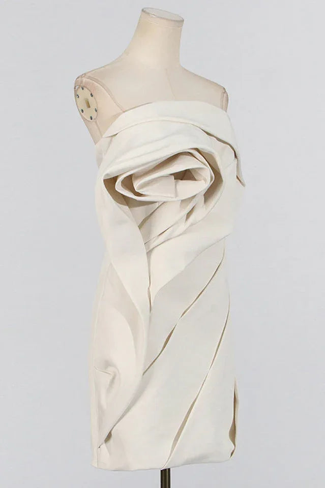 Front view of the off-white strapless mini dress on a mannequin, emphasizing the sculptural floral design.