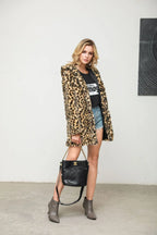 Model wearing a leopard print faux fur coat