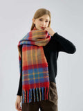 Woman adjusting her plaid scarf