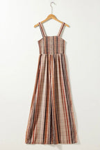 Striped wide-leg jumpsuit hanging on a hanger
