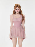 Model wearing a pink one-shoulder ruffled dress with a sheer skirt