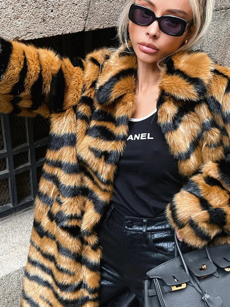 Close-up of a woman wearing a faux fur tiger stripe coat.
