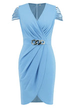 Close-up of the V-neck and draped front of a light blue sheath dress with a chain belt