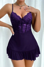 Woman wearing a deep purple lace trimmed chemise
