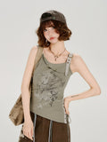 Close-up of the graphic print on a green tank top