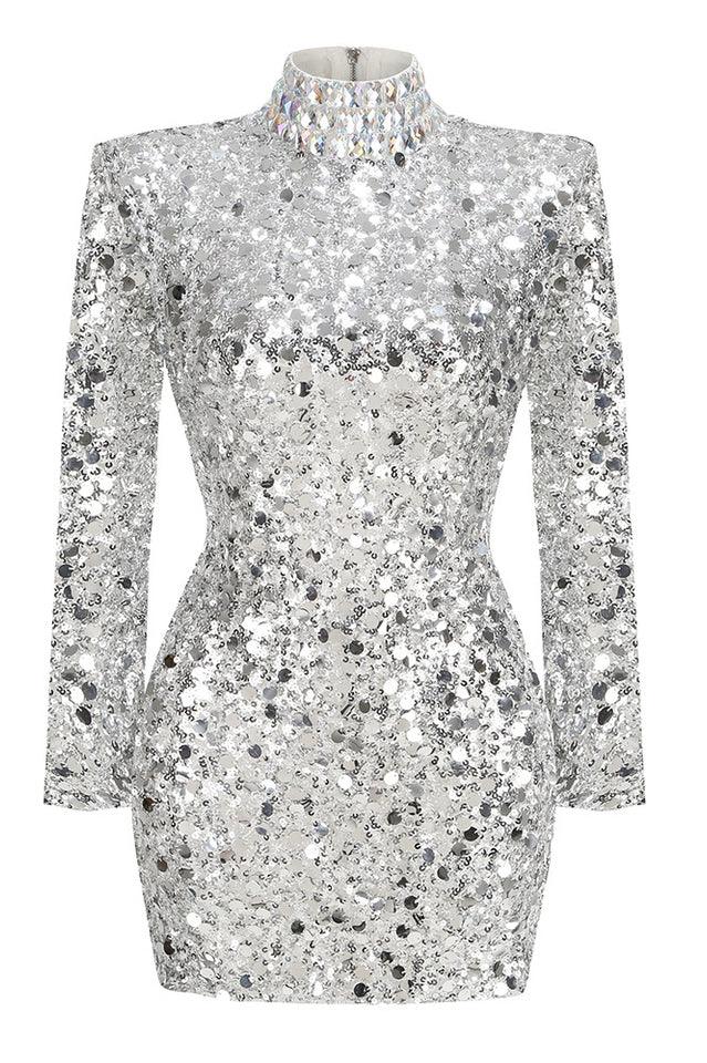 A mannequin displayed in a silver sequined long sleeve mini dress with a high neckline and padded shoulders.