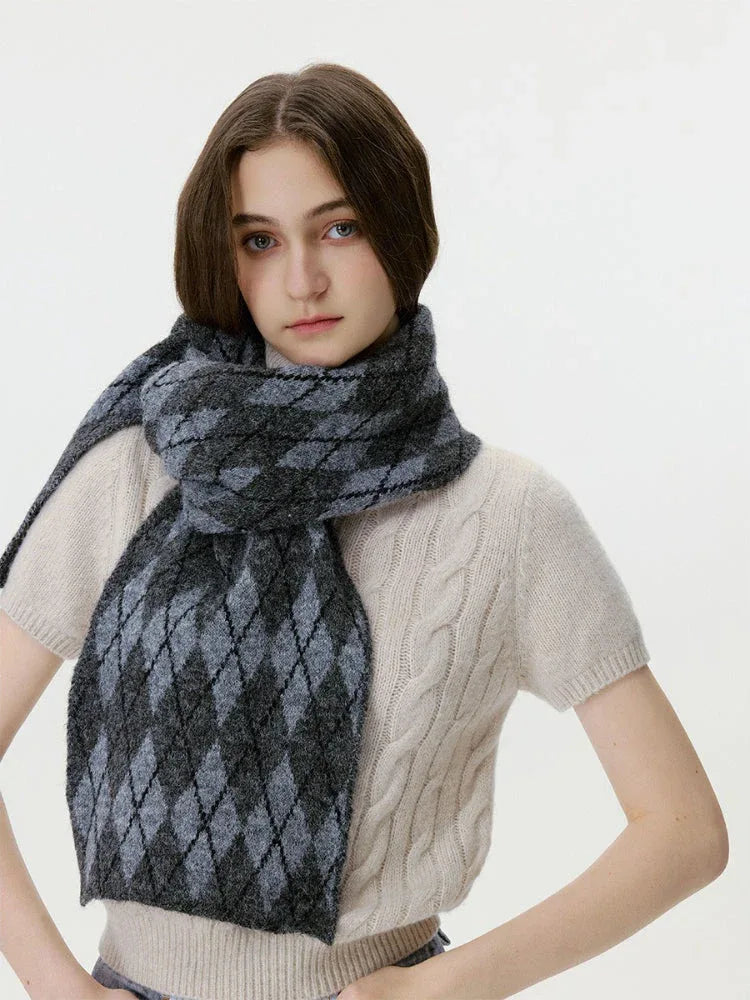 Woman posing with a gray and black argyle knit scarf