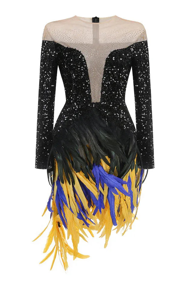 A black sequined mini dress with long sleeves, a sheer neckline, and a black, blue, and yellow feather fringe skirt, displayed on a mannequin.