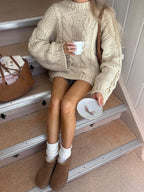 Woman wearing a pink chunky cable knit sweater - View 7 | WEUXS