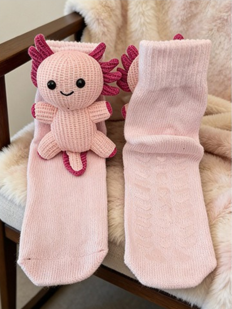 Pink knit crew sock with a pink axolotl applique on the side