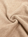 Close-up of beige knit fabric with visible texture.