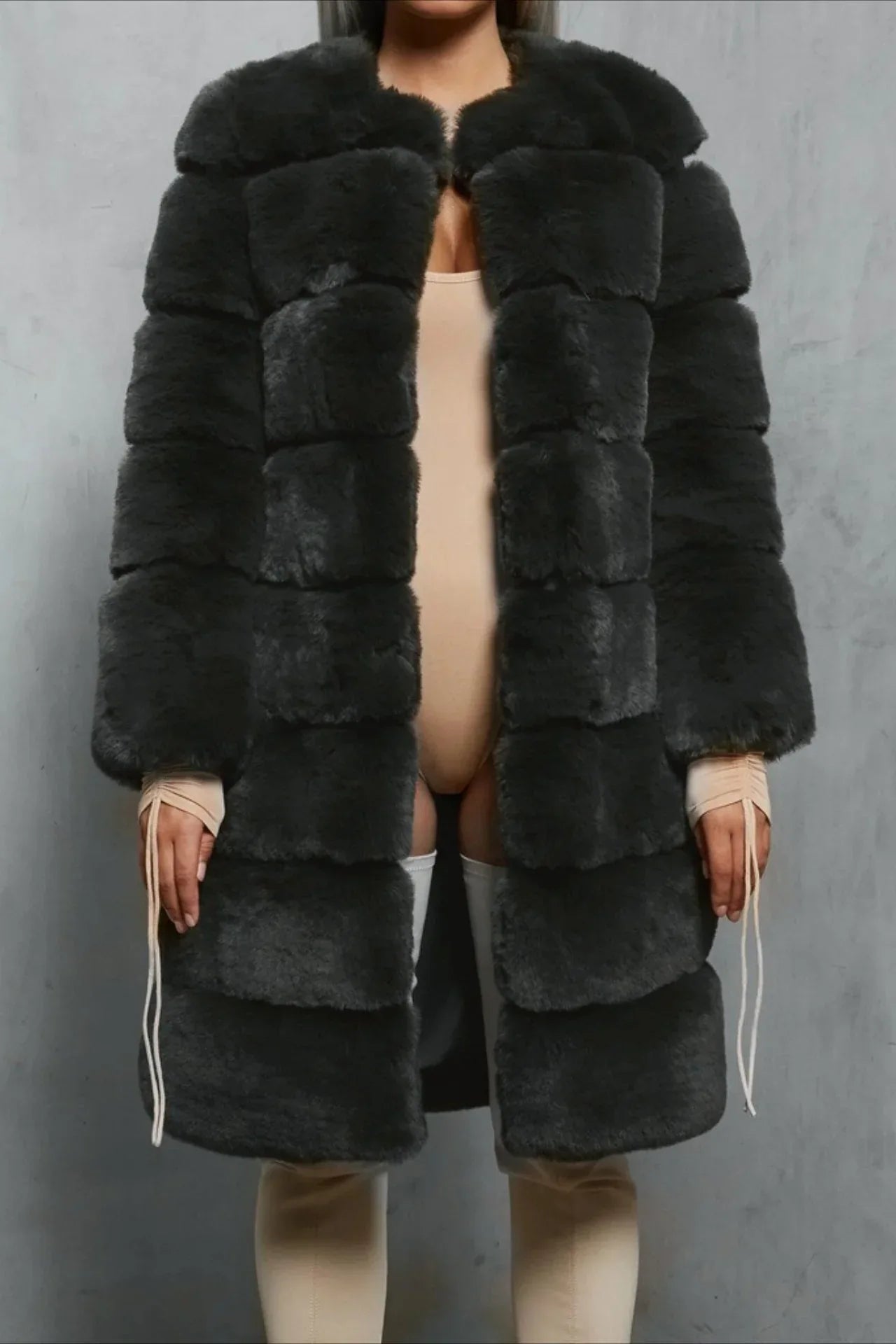 Woman in a dark grey faux fur coat