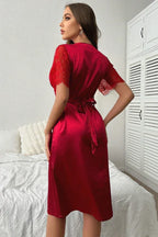 Elegant red satin midi dress with short lace sleeves