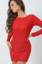 Woman wearing a red rhinestone long-sleeve bodycon mini dress, with hands on her hip.