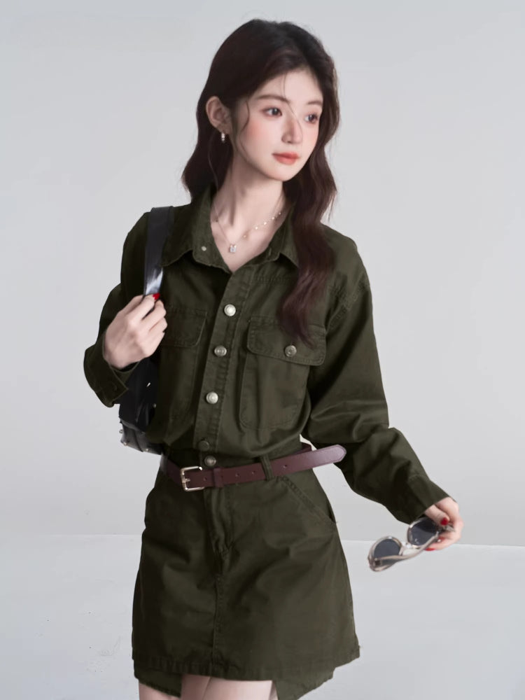 Woman wearing a long-sleeved olive green collared dress with button-down closure and two chest pockets.