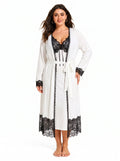Woman wearing a white robe with black lace trim over a white slip dress with black lace top