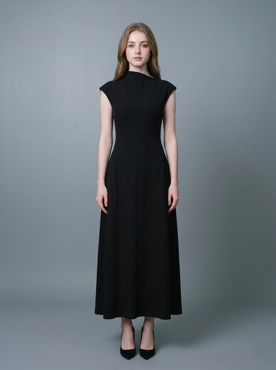 Woman wearing a sleeveless black A-line midi dress with a mock neck.