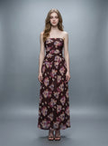 Woman wearing a strapless floral print chiffon maxi dress