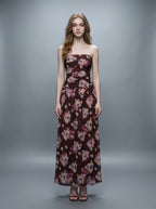 Woman wearing a strapless floral print chiffon maxi dress