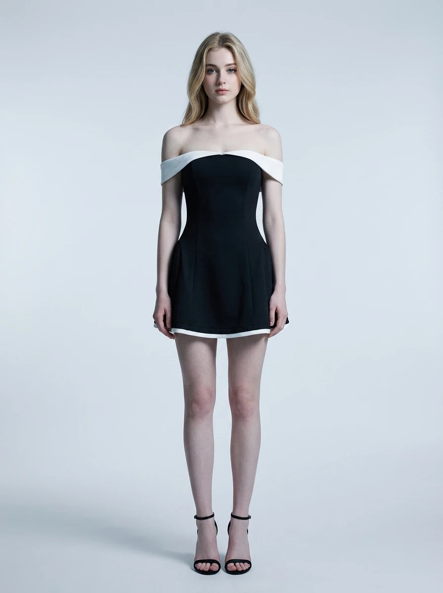 Woman in a black off-the-shoulder dress with white trim, front view