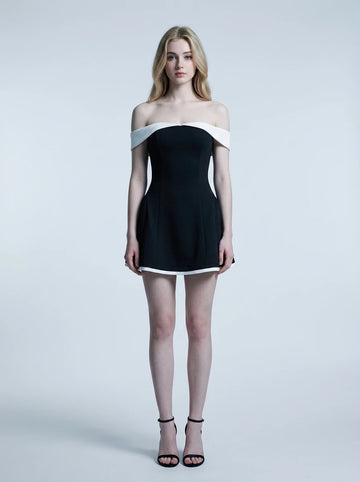 Woman in a black off-the-shoulder dress with white trim, front view