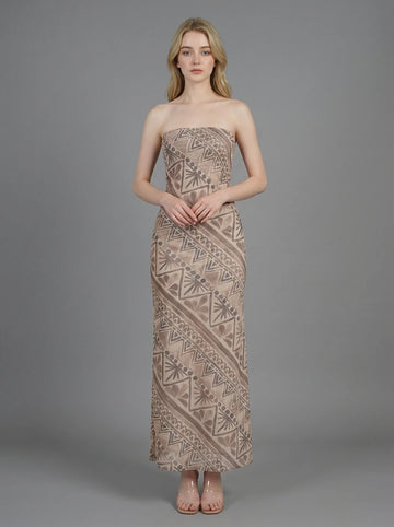 Woman in a strapless geometric print maxi dress