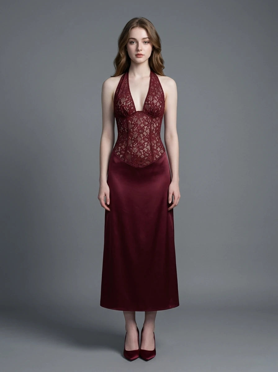 Woman wearing a burgundy lace and satin halter neck dress