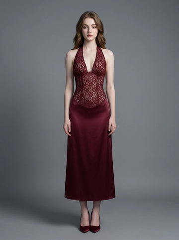 Woman wearing a burgundy lace and satin halter neck dress