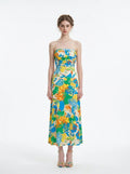 Woman wearing a strapless floral print midi dress