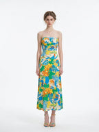 Woman wearing a strapless floral print midi dress