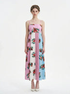 Woman wearing a colorblock floral print maxi dress with spaghetti straps